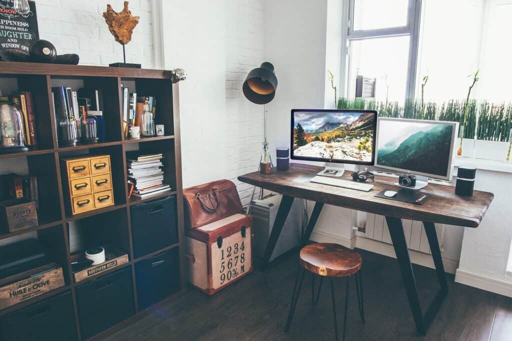 home office with large computer screen on the desk