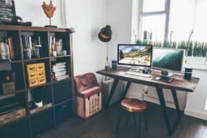 home office with large computer screen on the desk